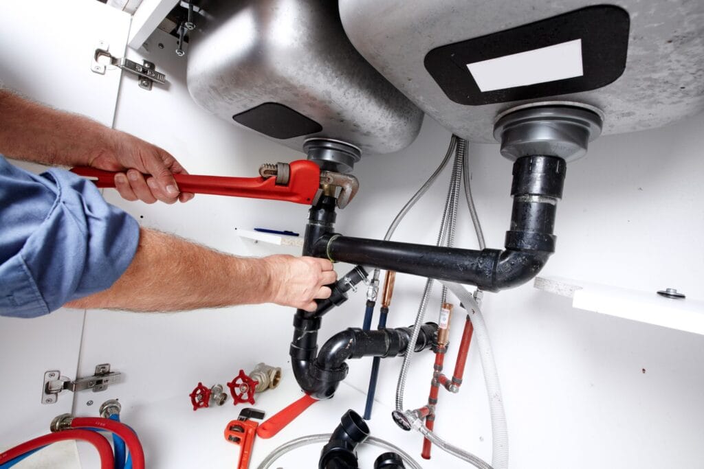 Mableton Plumbing Pros fixing under sink plumbing and drain pipes